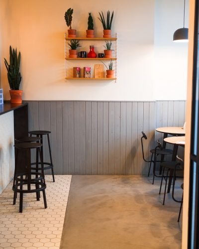 Empty cafeteria or bar with counter, chairs and tables