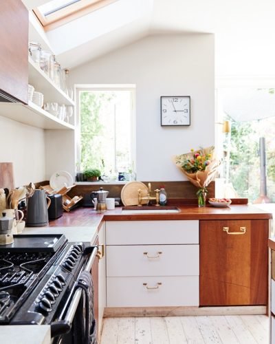 Empty Interior Of Contemporary Kitchen With Cooker And Storage